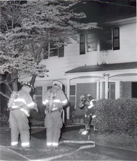 Capt. Villani F.F. Thomas getting ready to advance the hose line to the second floor